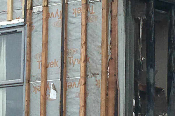 Bolton fire: combustible membrane pictured behind cladding on student halls