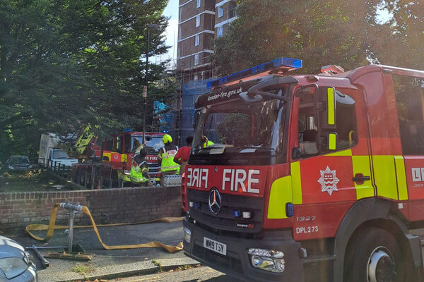 Man rescued from fire at council block in London