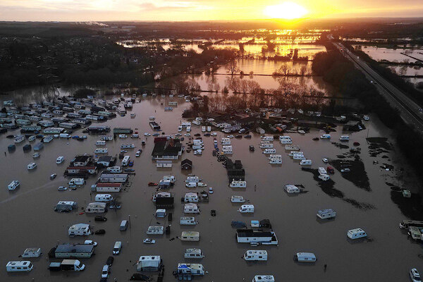 Hundreds of homes flooded and residents evacuated as warnings remain in place