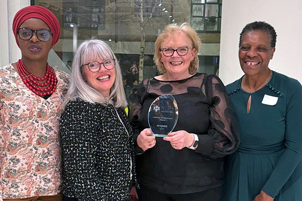 Jane Porter receiving the lifetime achievement award from Women in Social Housing Jane Porter receiving the lifetime achievement award from Women in Social Housing