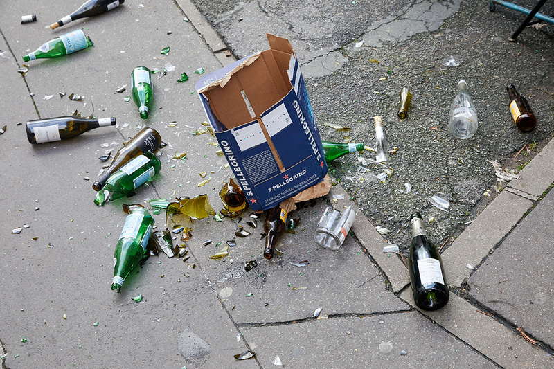 Discarded and smashed bottles on street