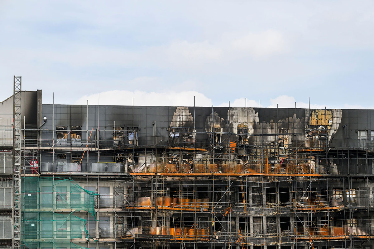 Spectrum building fire spread through scaffolding and timber-frame roof extension
