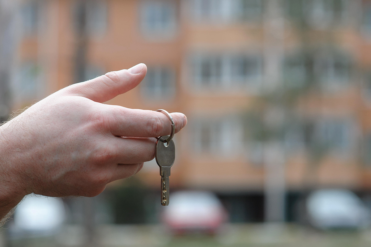 A hand holding a key