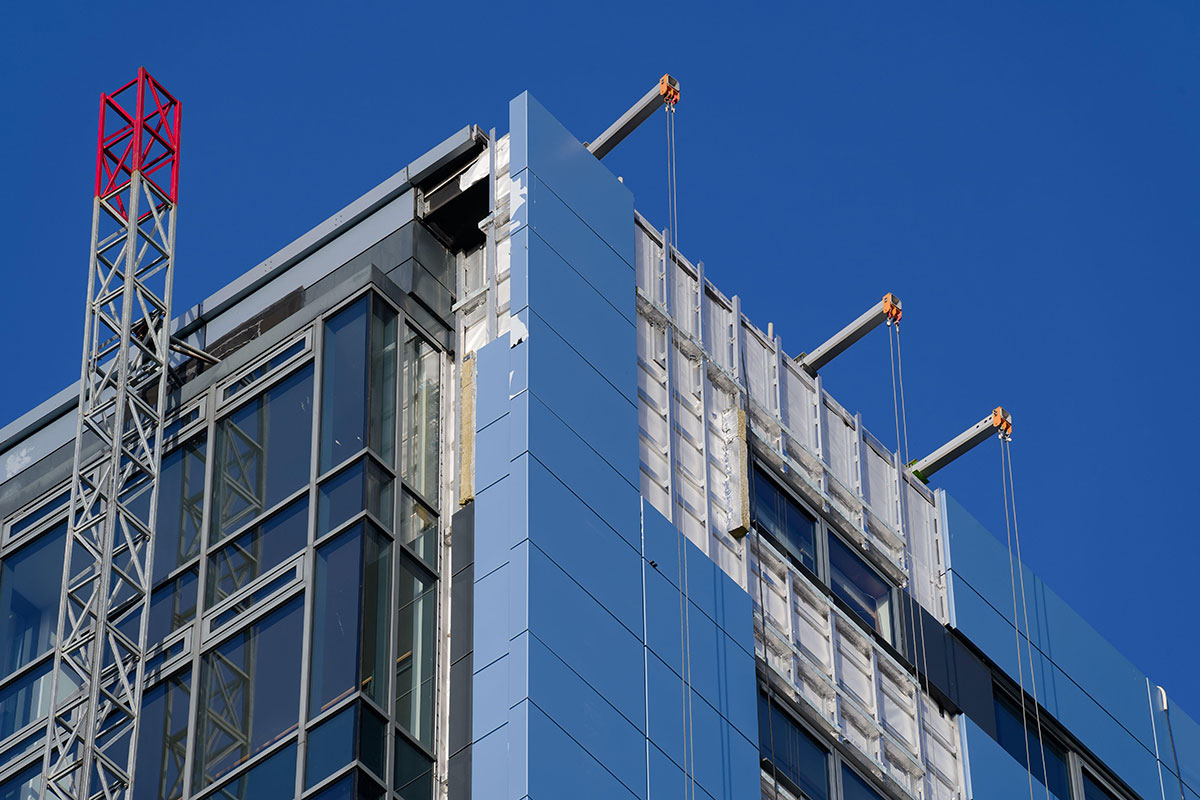 Cladding is replaced on a high-rise building
