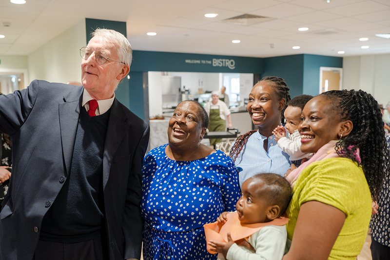 Hilary Benn with a family at the launch party for Preferred Homes&rsquo; Hunslet Moor House development in Leeds