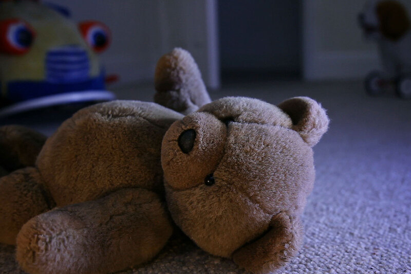 Teddy bear lying on the ground Teddy bear lying on the ground