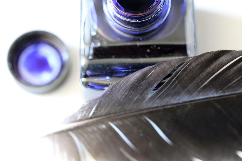 Pot of ink with a quill