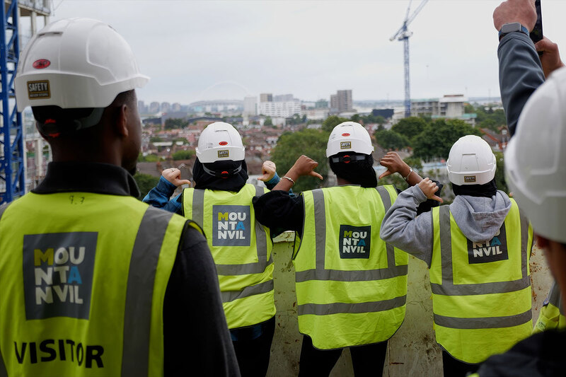 Four men wearing hi-vis jackets