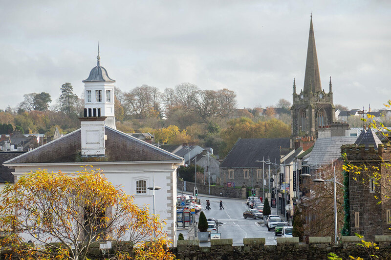 A high street with a church in the town of Antrim A high street with a church in the town of Antrim