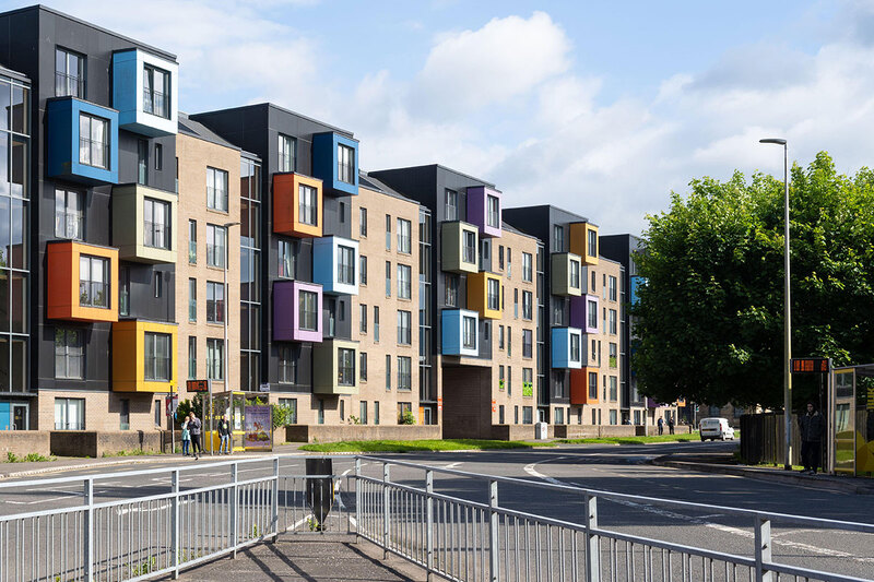 A modern housing development with colourful bay windows