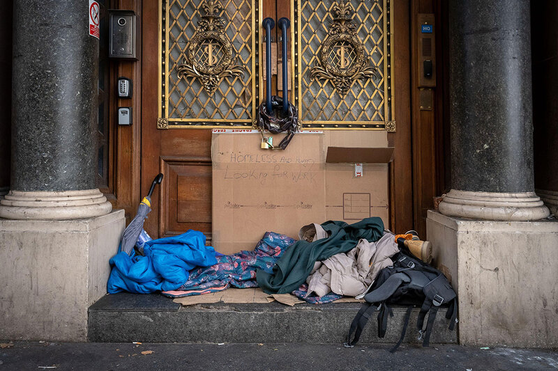 A rough sleeper’s belongings on a doorstep in London A rough sleeper’s belongings on a doorstep in London