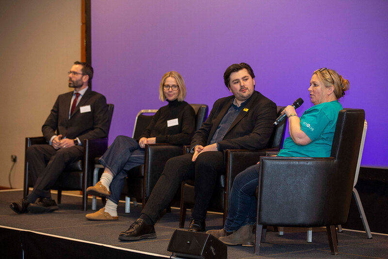 Four speakers at a conference