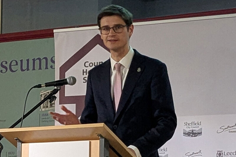 Tom Hunt speaking at a housing summit