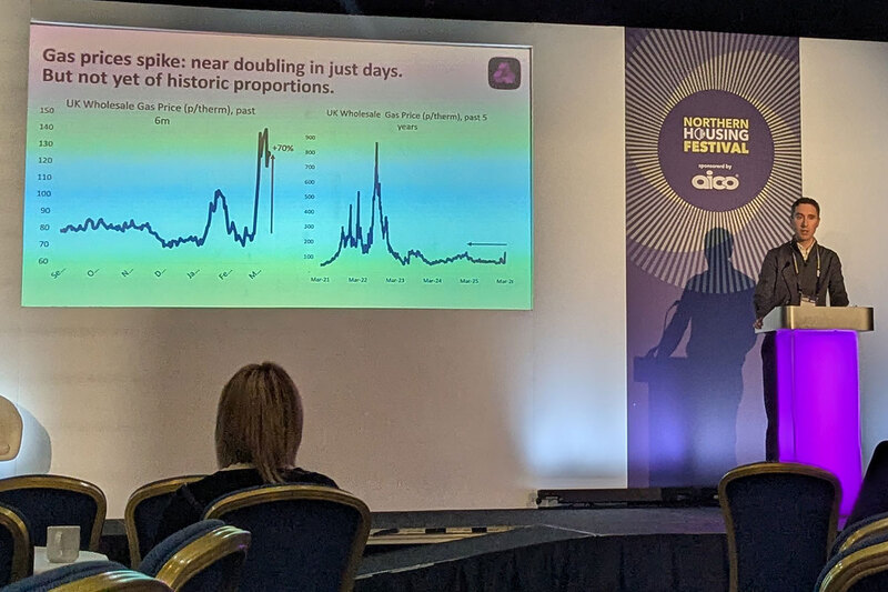 A man speaking at a housing festival A man speaking at a housing festival