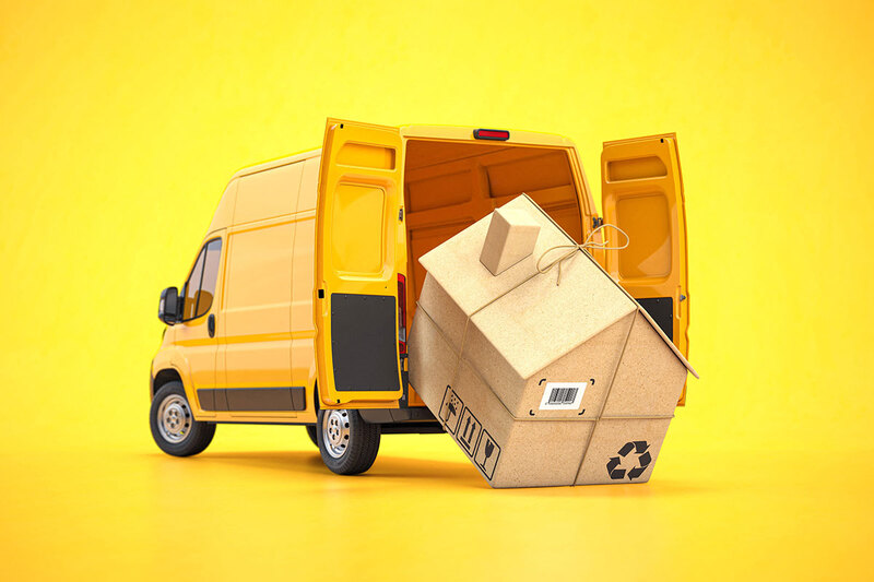 A yellow moving van with a cardboard ‘house’ emerging from the back A yellow moving van with a cardboard ‘house’ emerging from the back