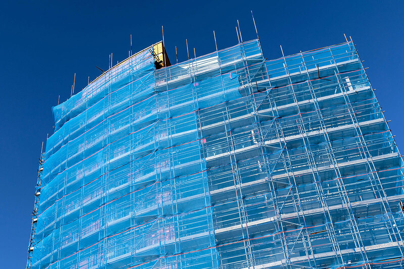 A building in London undergoing cladding remediation